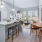 pendant lights over kitchen island next to dining table