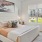 a bedroom with a large window