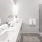 a bathroom with a walk-in shower with glass door