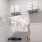 well lit walk-in closet with shelving