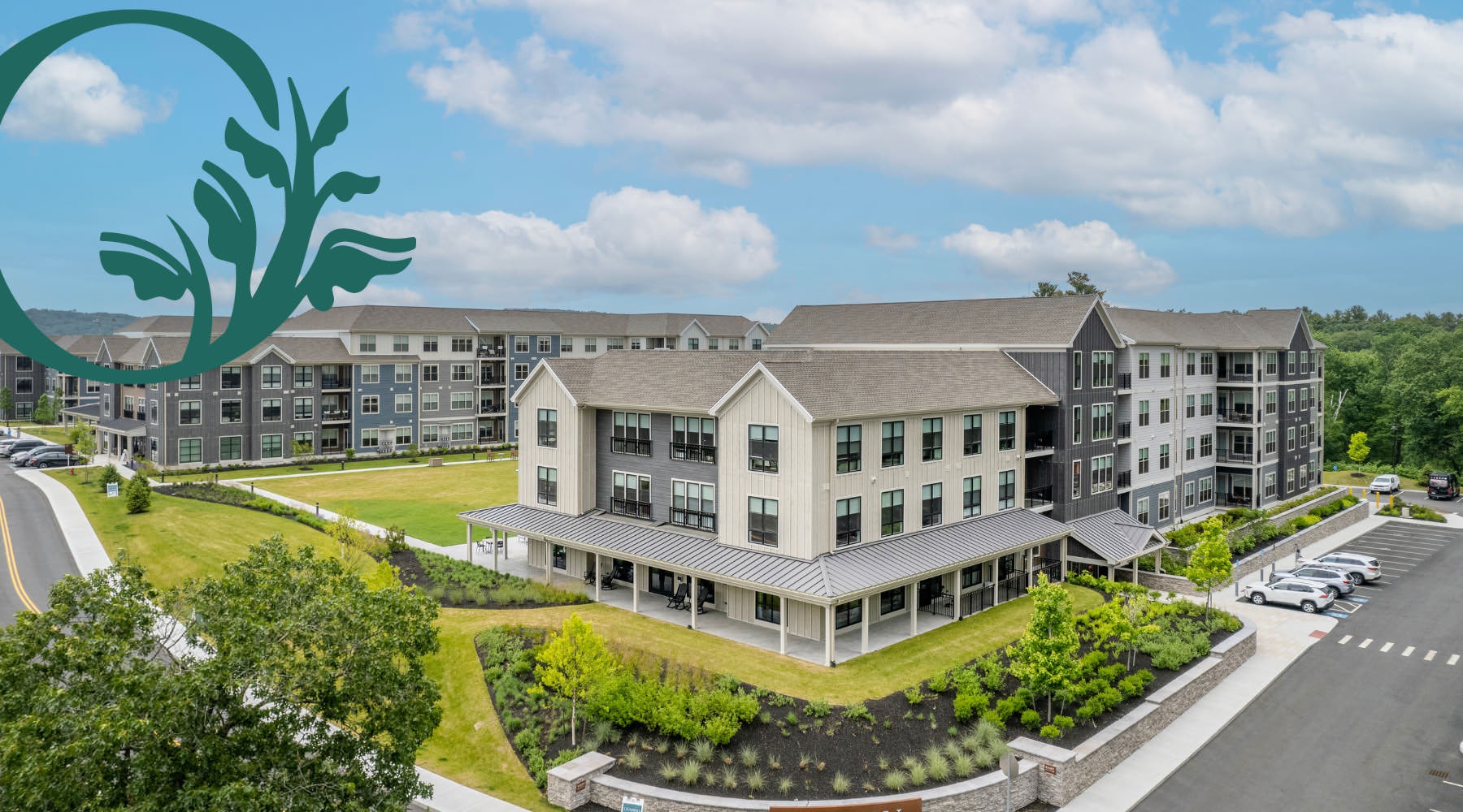 Where Luxury Meets Lifestyle Aerial shot of Oxbow Wayland property with a logo overlaying the photo