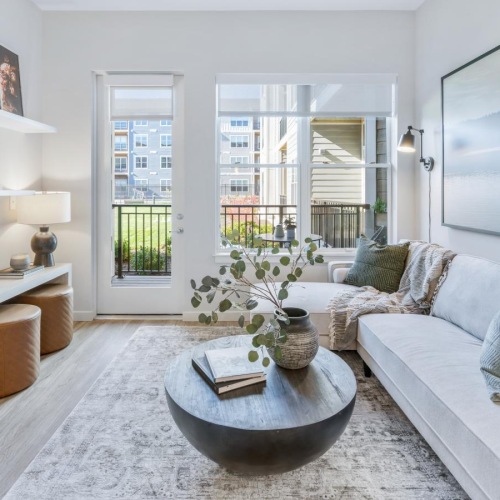 Wide open living areas flooded with natural light bright living room with access to private patio